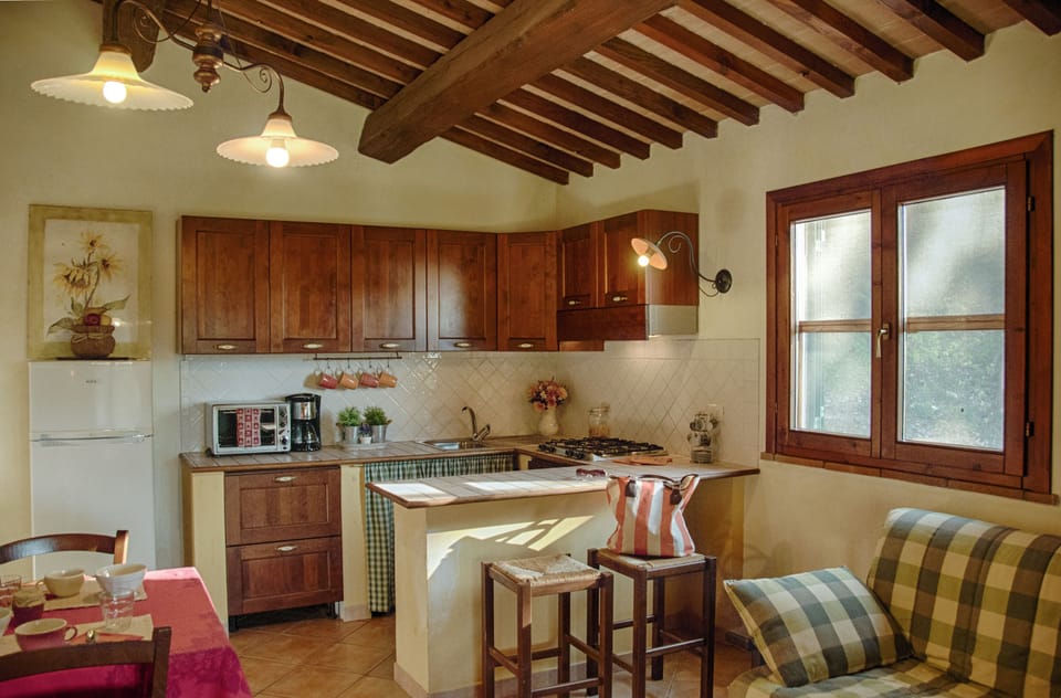 Apartment, 2 Bedrooms, Garden View (I Noci) | Private kitchen | Fridge, stovetop, coffee/tea maker, highchair