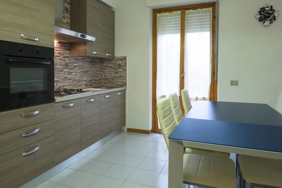 Apartment, 3 Bedrooms | Private kitchen | Full-size fridge, oven, stovetop, coffee/tea maker