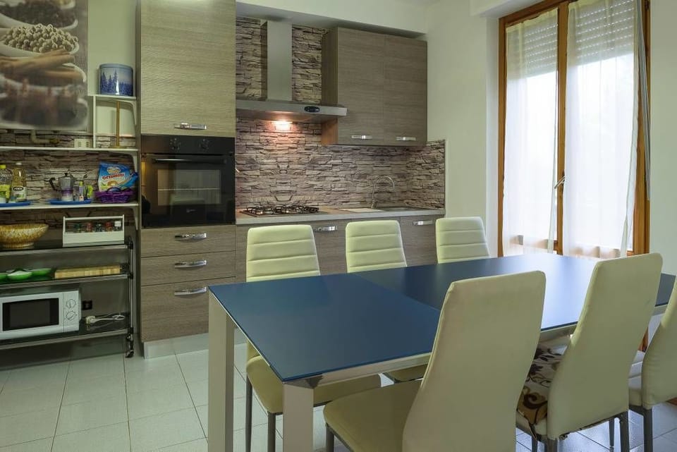 Apartment, 3 Bedrooms | Private kitchen | Full-size fridge, oven, stovetop, coffee/tea maker