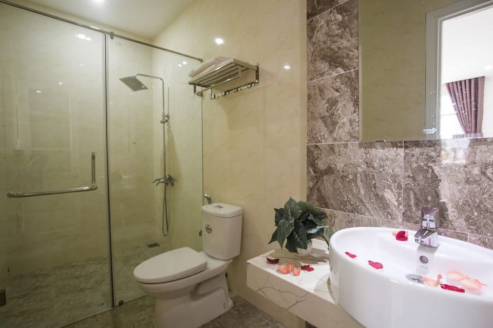 Shower, free toiletries, hair dryer, slippers