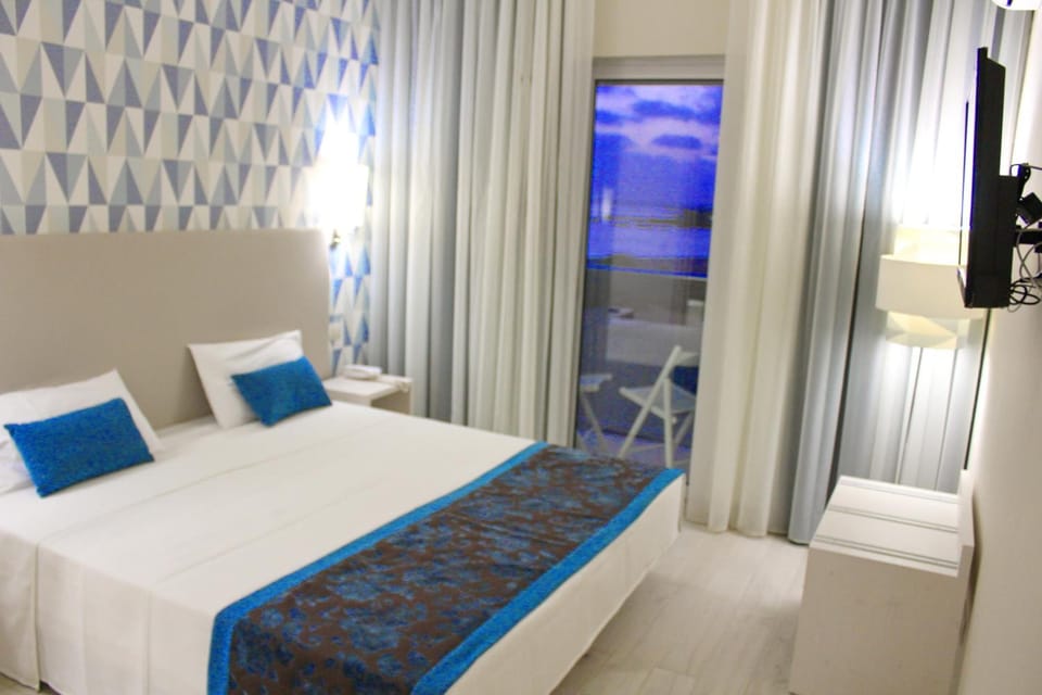 Minibar, desk, blackout drapes, bed sheets