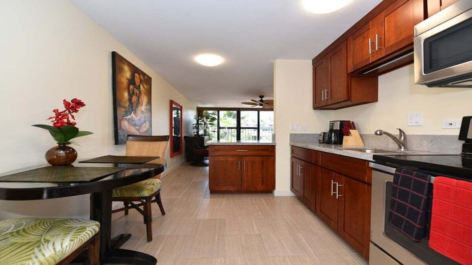 Functional open-plan design showcasing a dining area, kitchen, and living room for a comfortable stay