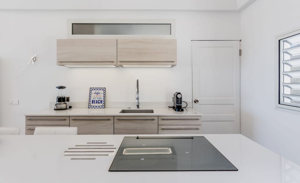 KITCHEN,LAUNDRY AT THE BACK.