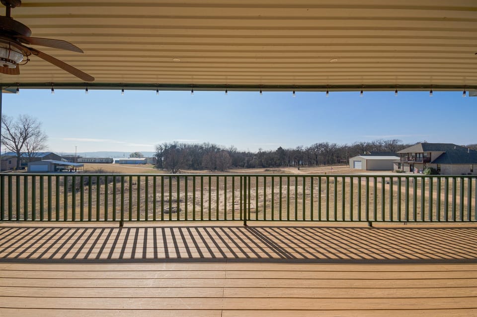 Upstairs Balcony Off Game Room - Lake Texoma is on the other side of those trees, about a 2 block walk.)