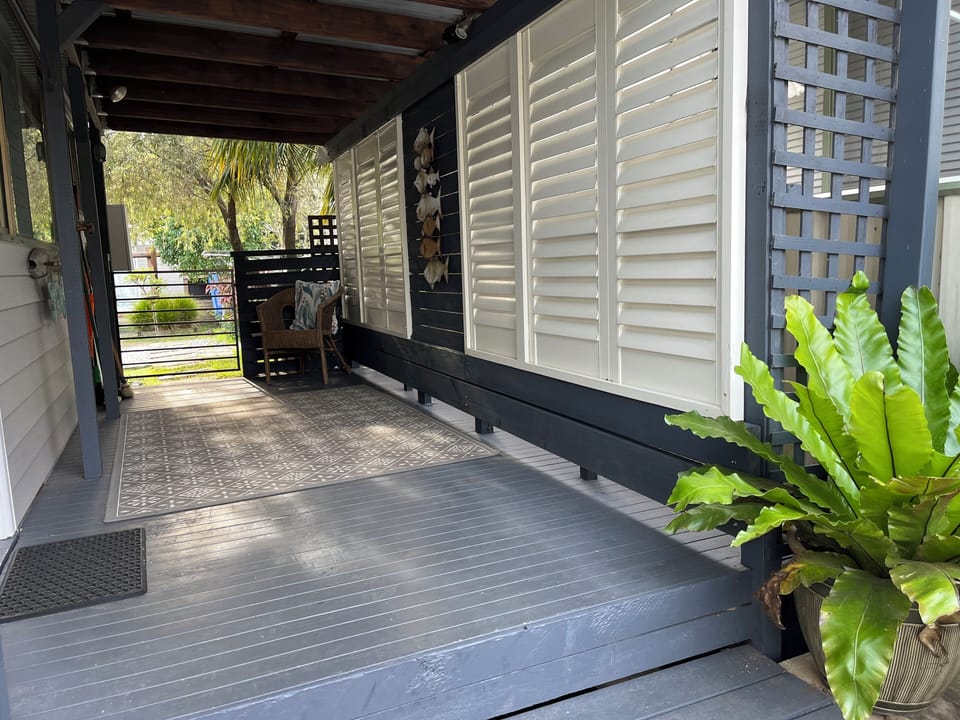 Side deck to front door and access to backyard. Side gate to keep your dog safe.