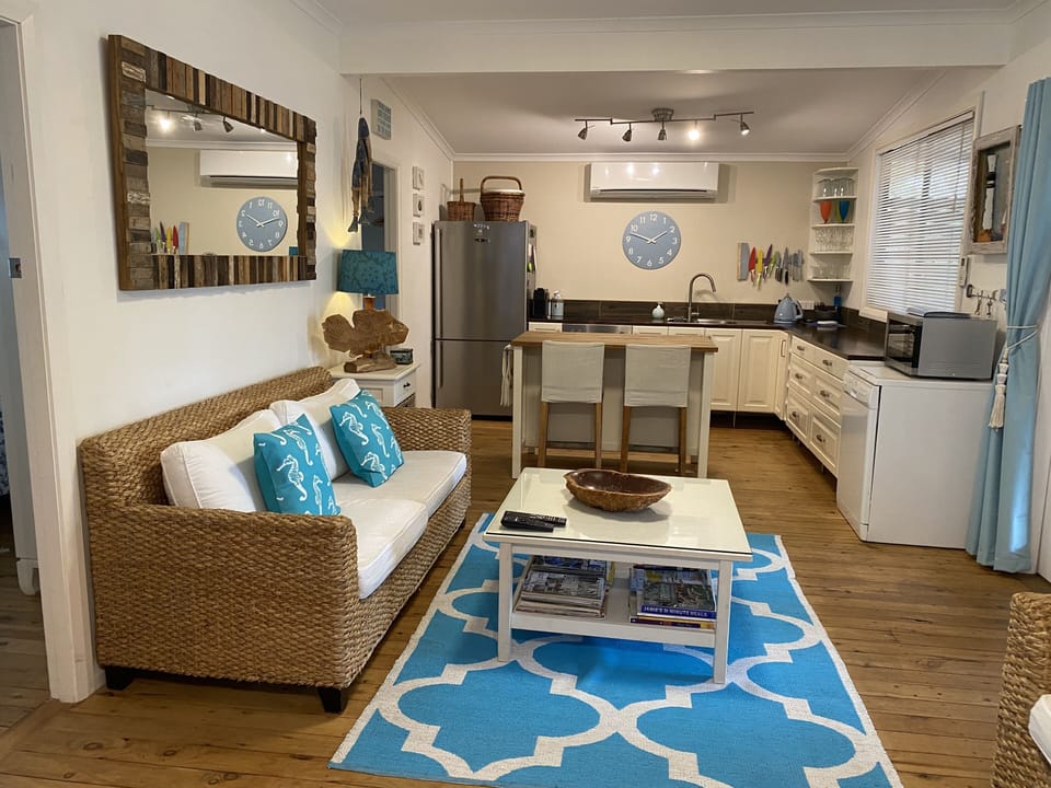 Walk into an open planned lounge and kitchen living area.