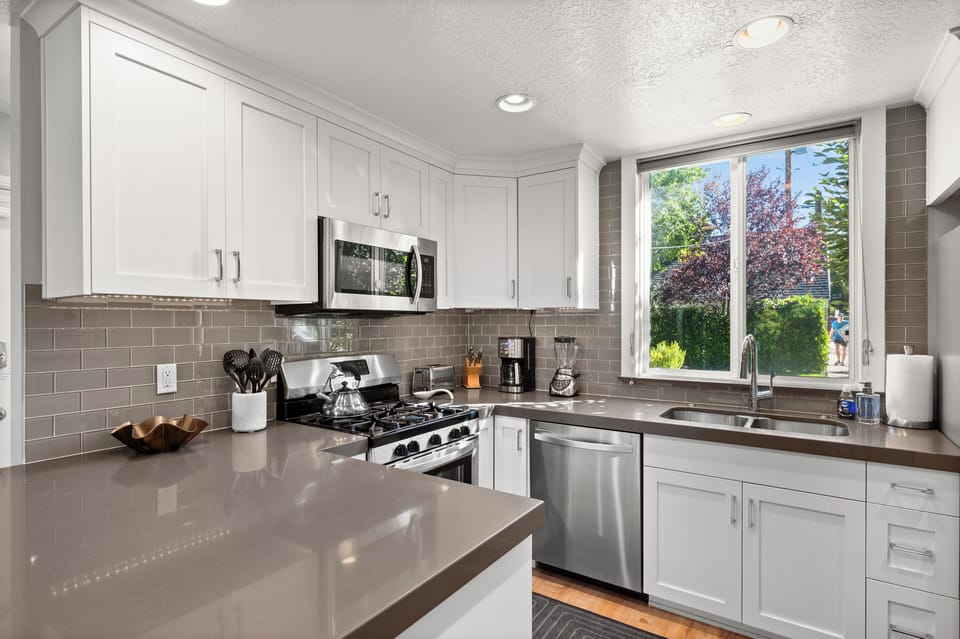 Fully stocked kitchen with utensils, pots/pans, blender, toaster, drip coffee