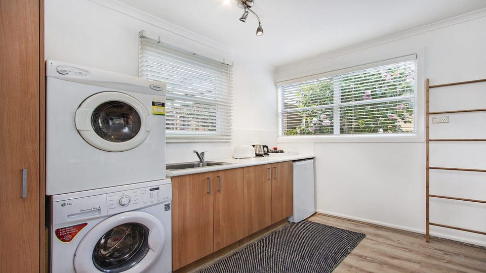 Bay Cottage | Kitchenette in cabin | Bar fridge | Clothes dryer, Washing machine