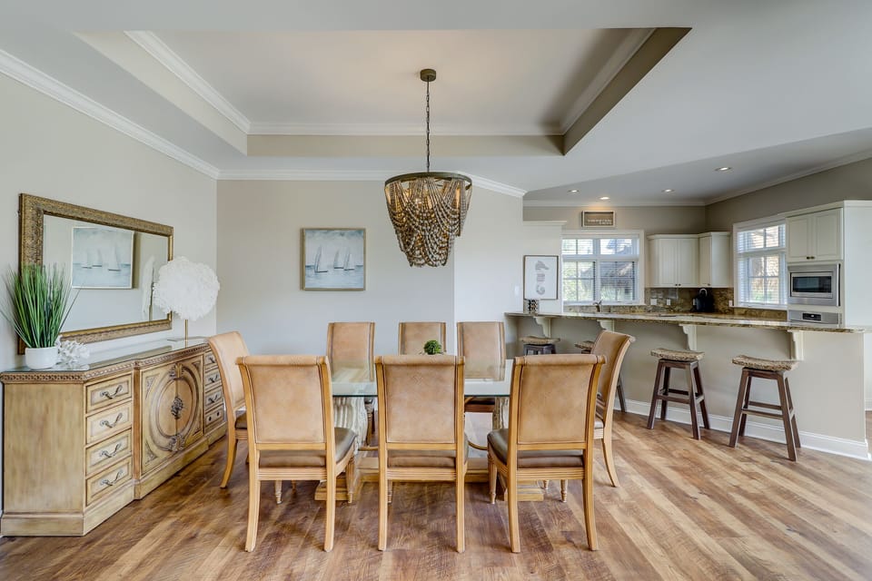 Dining room.  Seating for eight at the table with four more at the counter.
