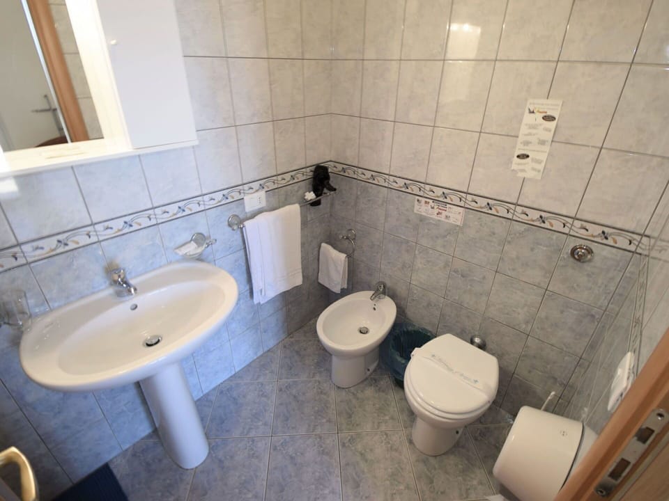 Bathroom, Property, Toilet, Tile, Room, Floor, Wall, Architecture, Plumbing Fixture, Tap
