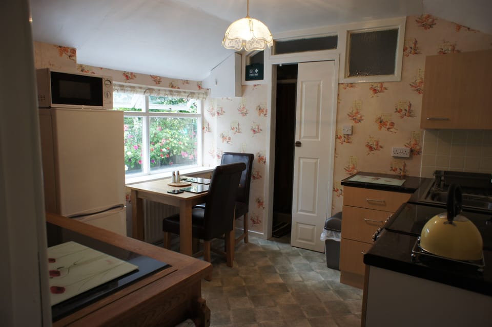 Table for two in front of the window, a fridge/freezer - real self catering