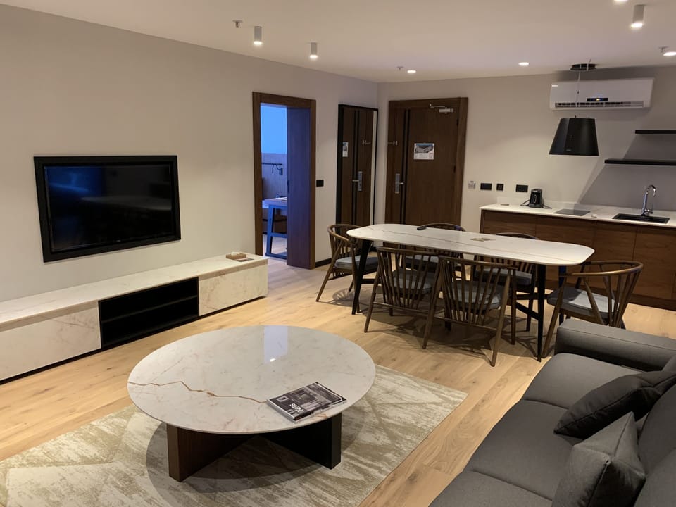 Grand Suite | Living area | 49-inch TV with cable channels
