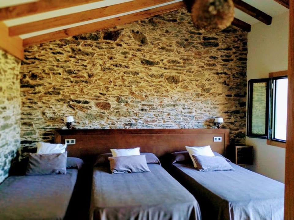 Triple Room, Private Bathroom | Desk, blackout drapes, free cribs/infant beds, rollaway beds