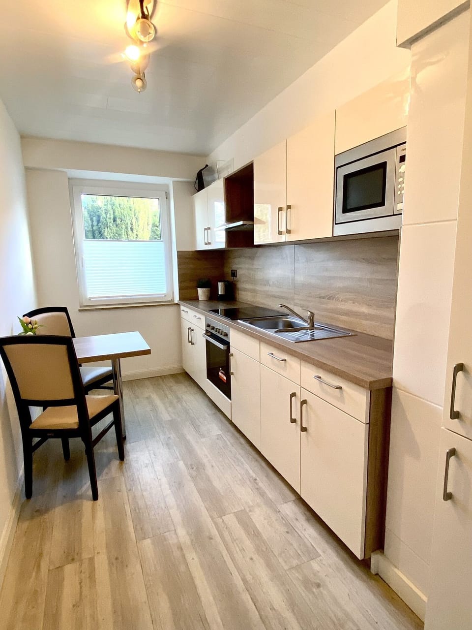 Basic Condo | Private kitchen | Oven, stovetop, electric kettle, cookware/dishes/utensils