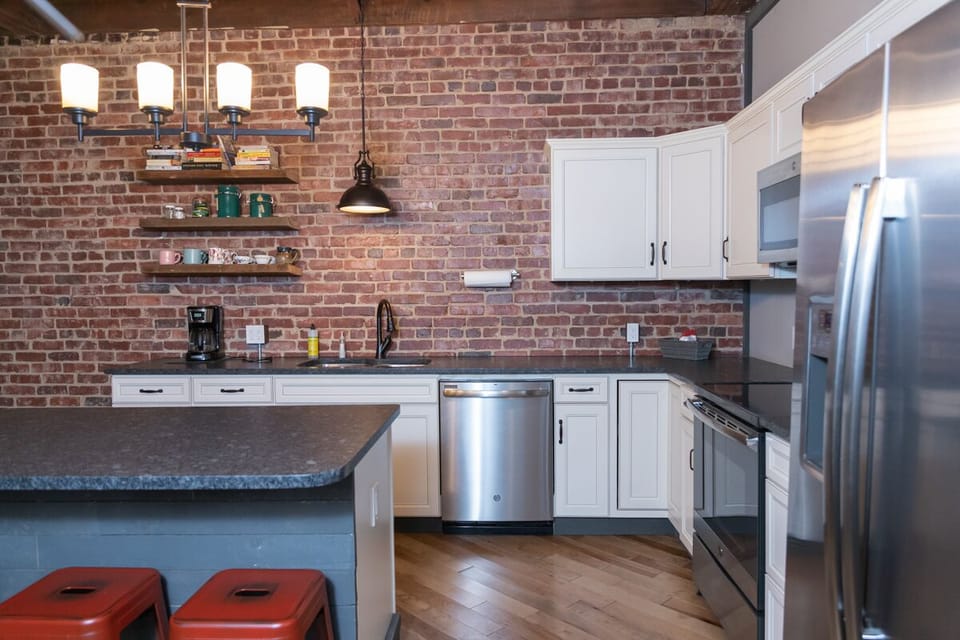 Kitchen with granite countertops & stainless steel appliances