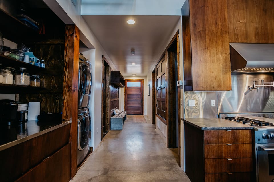 Front entry with large coatrack and shoe storage.  Large capacity washer/dryer. 