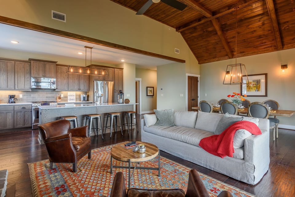 Open Great Room with Tongue in Groove Ceilings and Exposed Beams!