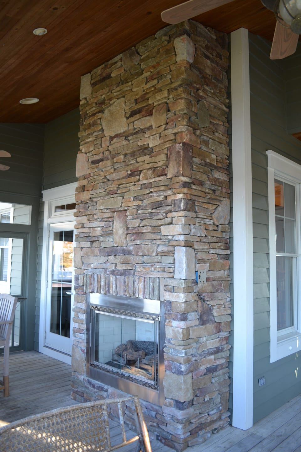 Screened Porch (main) gas log fireplace