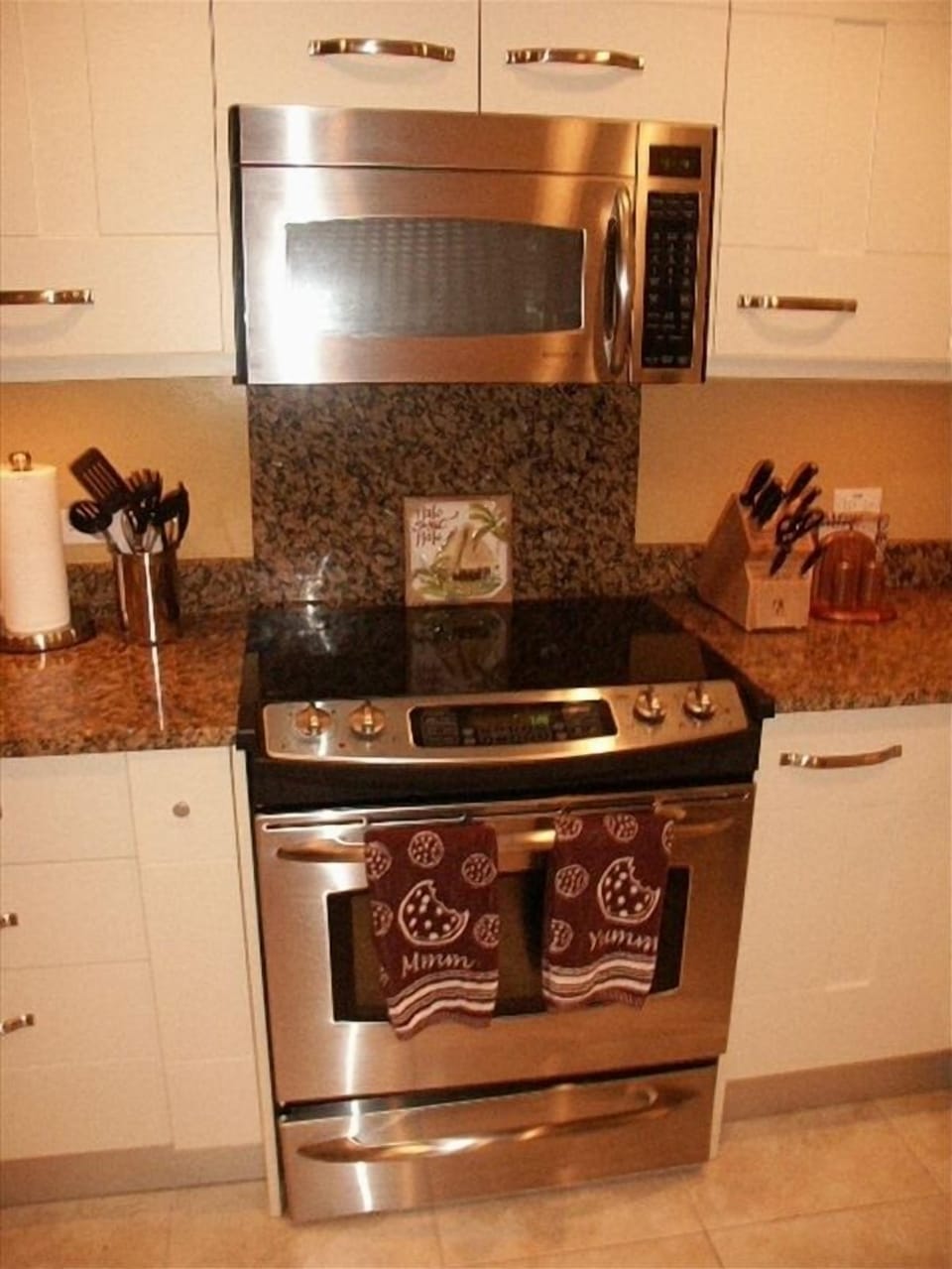 Glass cooktop, stainless steel stove, and microwave