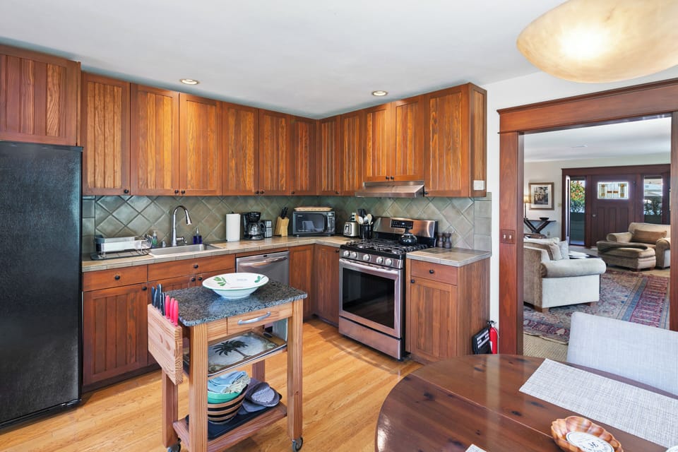 Custom cabinets, fine gas range, fridge, DW, coffee maker, and microwave. 