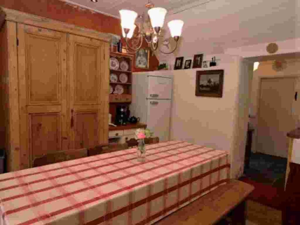 Farm table seats 6. Good size Normande fridge is great for stocking up.