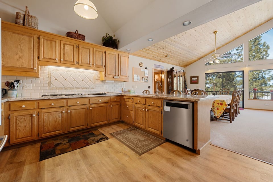 Enjoy the kitchen's gas range and granite countertops