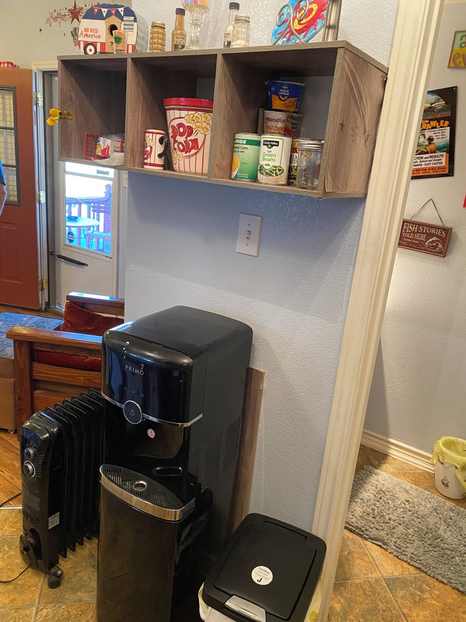 Cabinet area & bottled water, for  other essentials. Some spices provided.