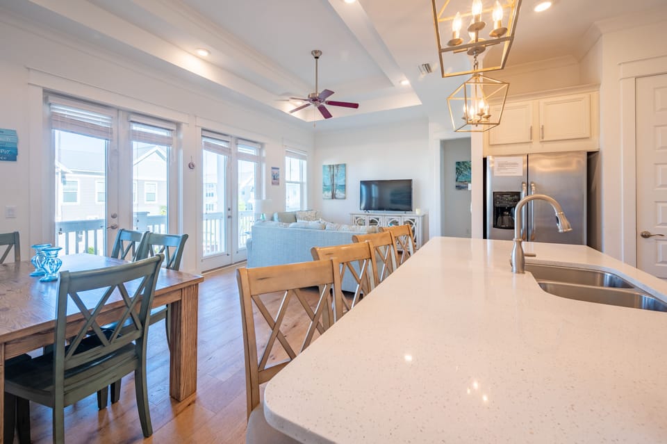 55" Smart TV can be viewed within dining room and kitchen.