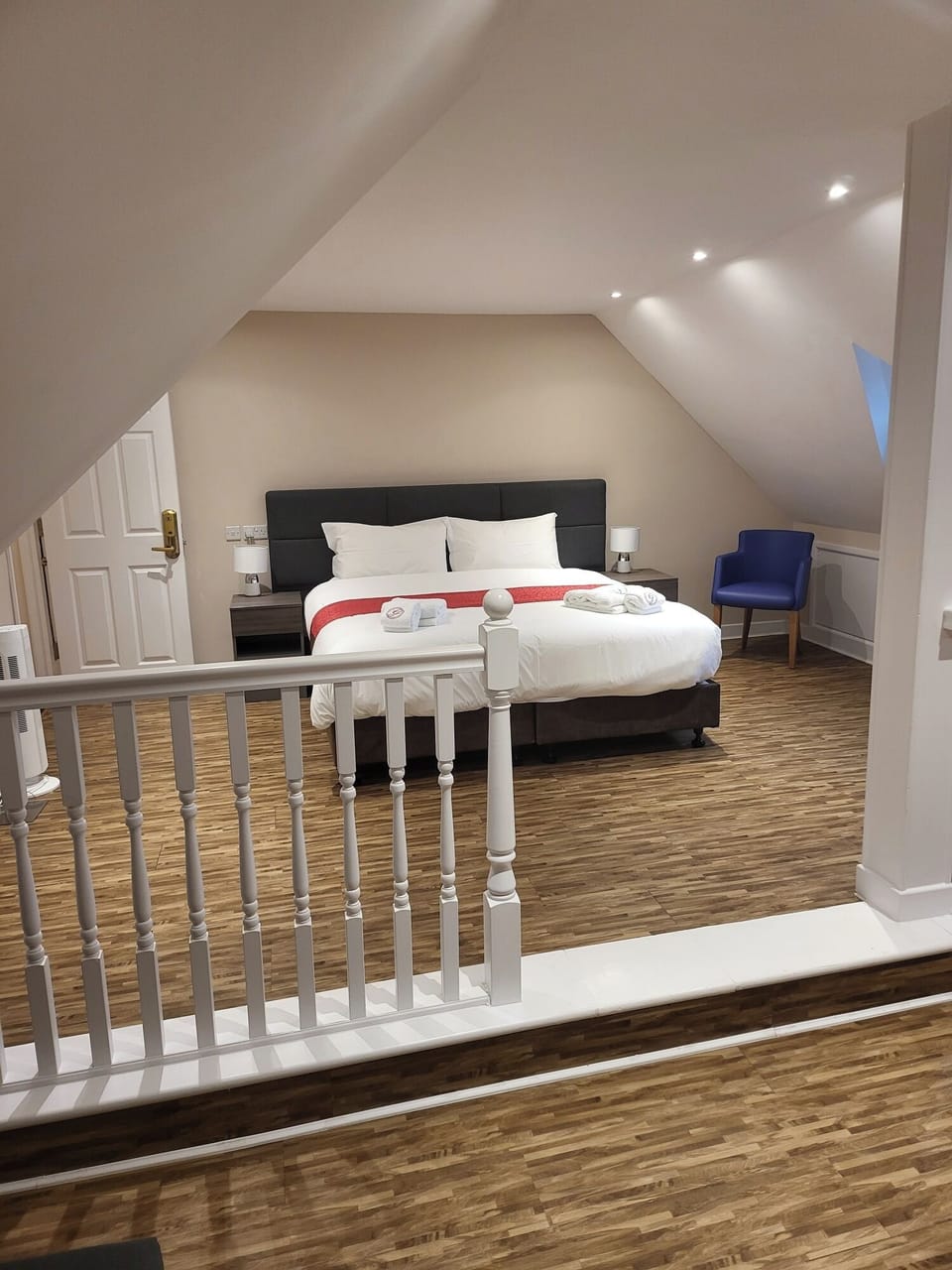 Premium bedding, desk, laptop workspace, soundproofing