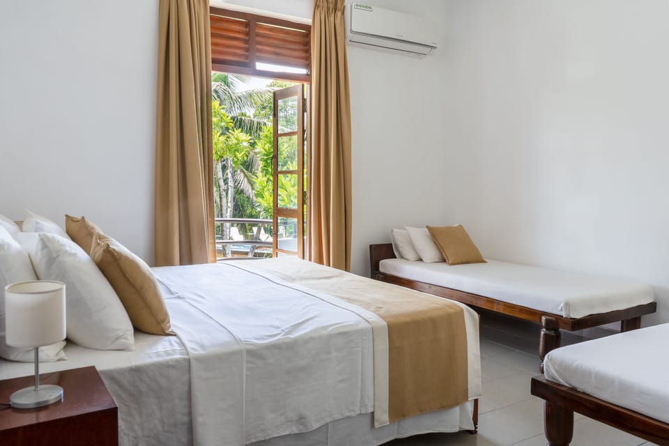 Deluxe Quadruple Room, 1 Bedroom, Balcony, Pool View | Blackout drapes, iron/ironing board, bed sheets