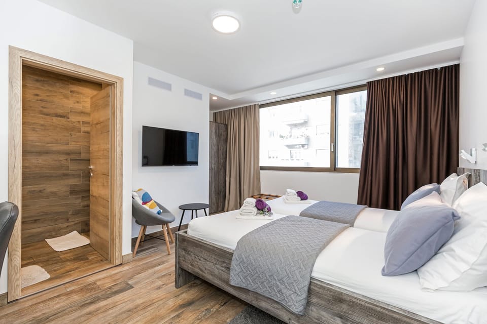 Deluxe Double or Twin Room, City View | Minibar, in-room safe, desk, iron/ironing board