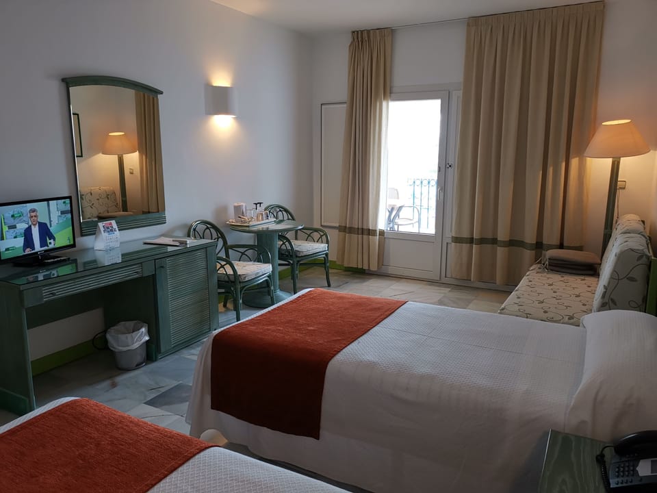 Standard Double Room | Minibar, in-room safe, desk, blackout drapes