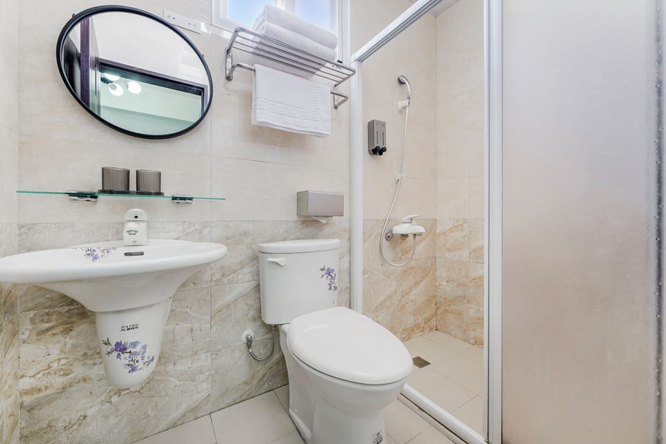 Standard Double Room | Bathroom | Shower, hair dryer, slippers, towels
