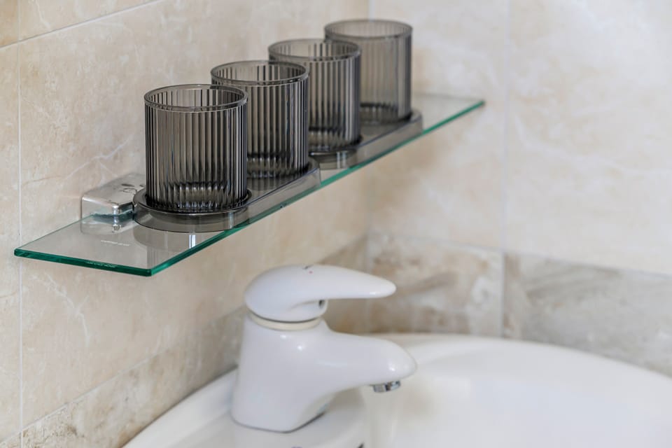 Quadruple Room, Balcony | Bathroom | Shower, hair dryer, slippers, towels