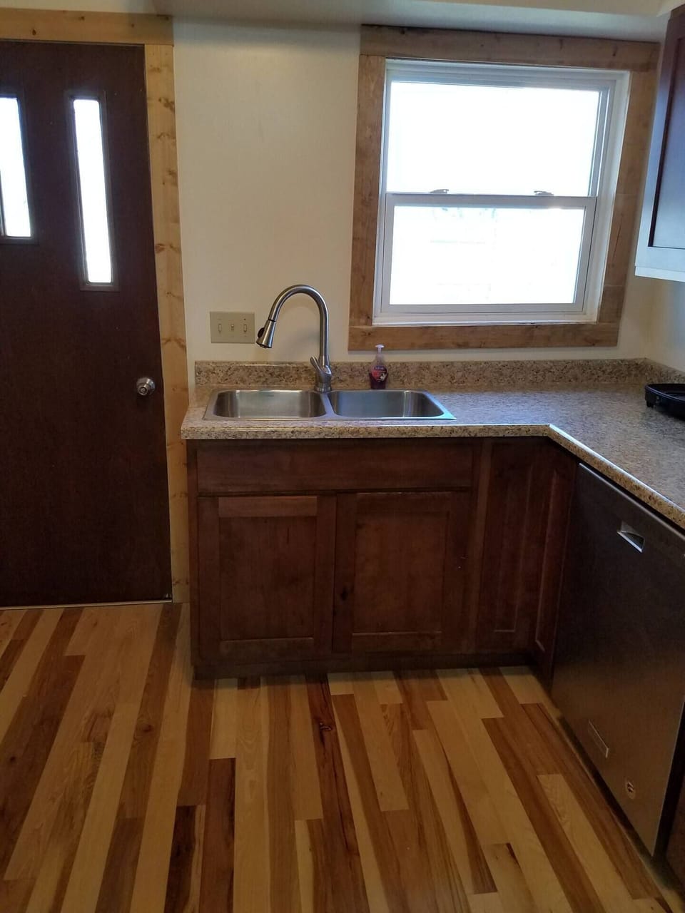 The kitchen offers a sink with a pull out faucet  for easy clean up as well as a dishwasher. We've stocked the cupboards and drawers with dishes and cutlery and many kitchen gadgets.