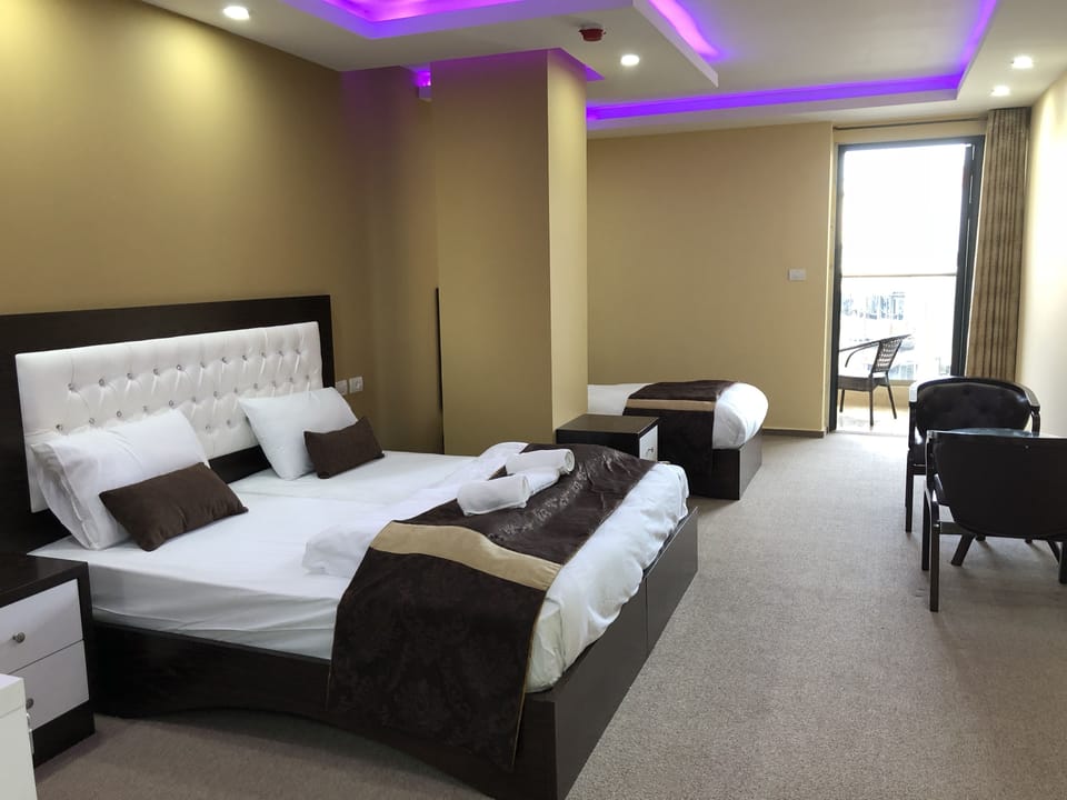 Deluxe Triple Room, Multiple Beds, Non Smoking | 3 bedrooms, free minibar, in-room safe, individually decorated