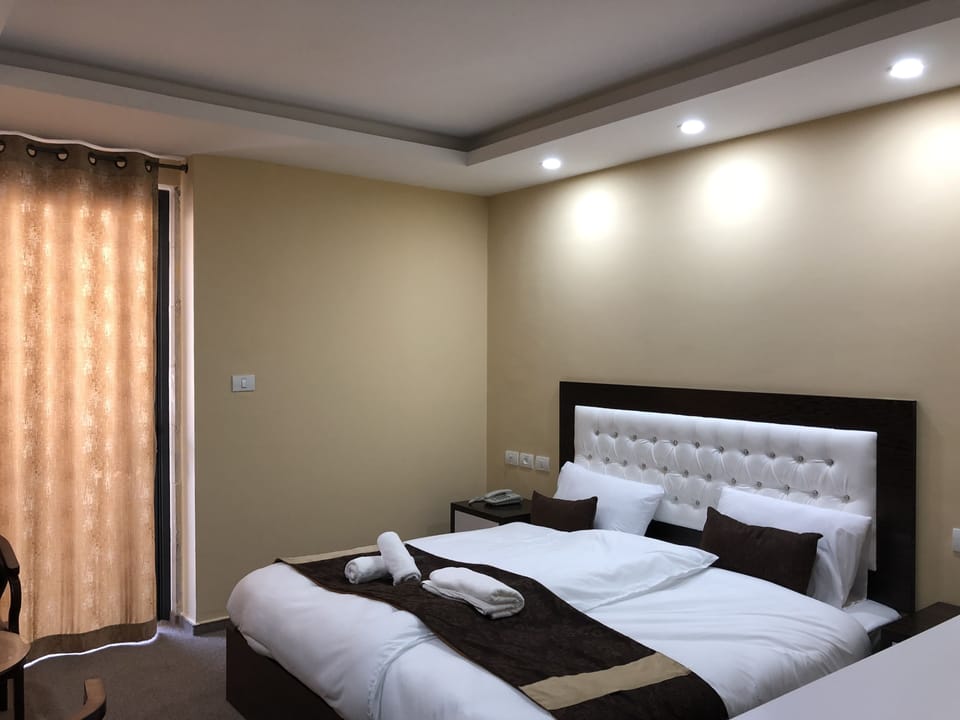 Deluxe Quadruple Room, Multiple Beds, Non Smoking | 3 bedrooms, free minibar, in-room safe, individually decorated