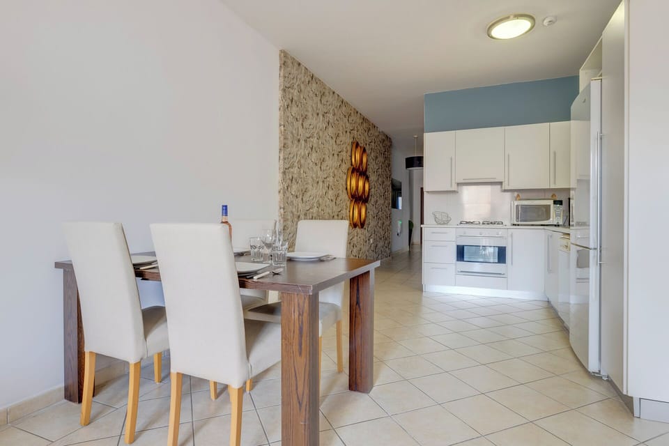Apartment, 2 Bedrooms, Balcony | Living area | Flat-screen TV