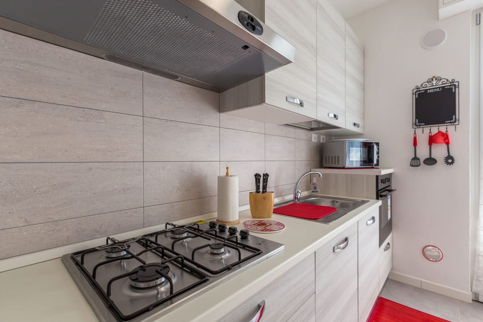 Apartment, 2 Bedrooms | Private kitchen | Full-size fridge, microwave, stovetop, dishwasher