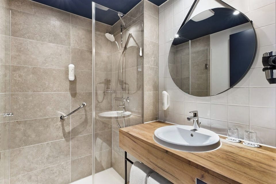 Shower, rainfall showerhead, eco-friendly toiletries, towels