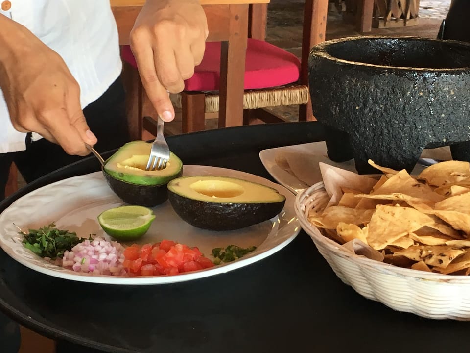 table side guacamole being prepared at a nearby restaurant