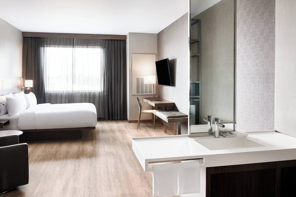 Hypo-allergenic bedding available, in-room safe, desk, laptop workspace