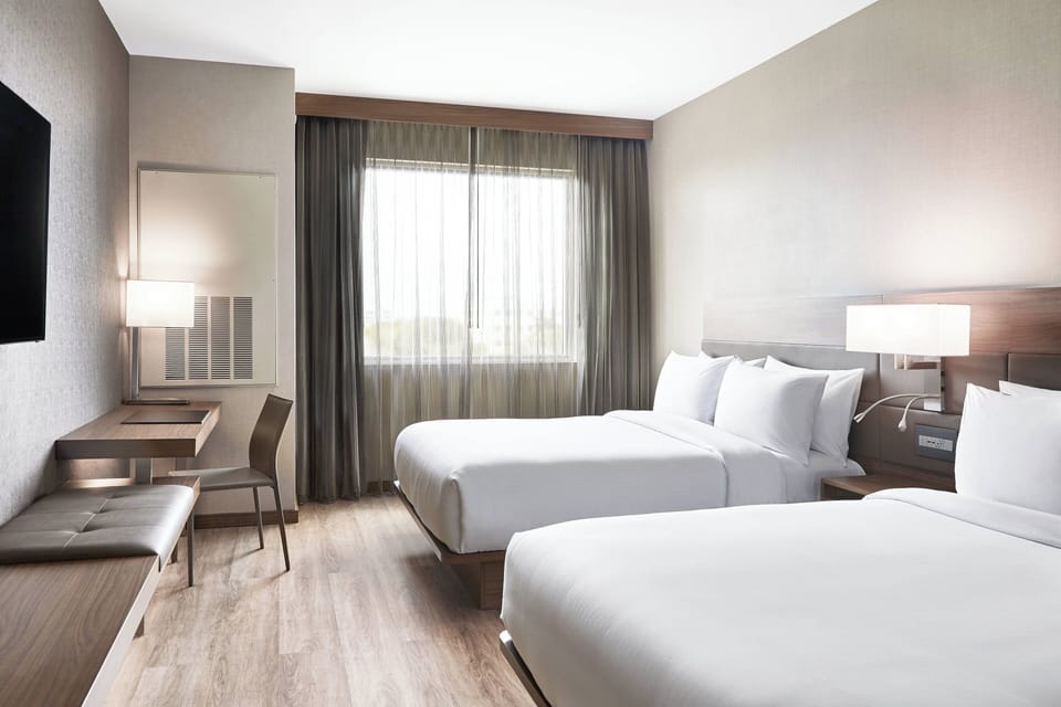 Hypo-allergenic bedding available, in-room safe, desk, laptop workspace