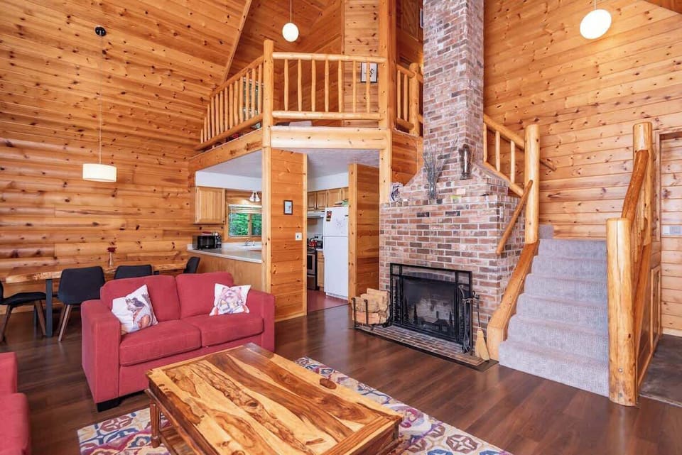 Living Room with open floor plan and loft