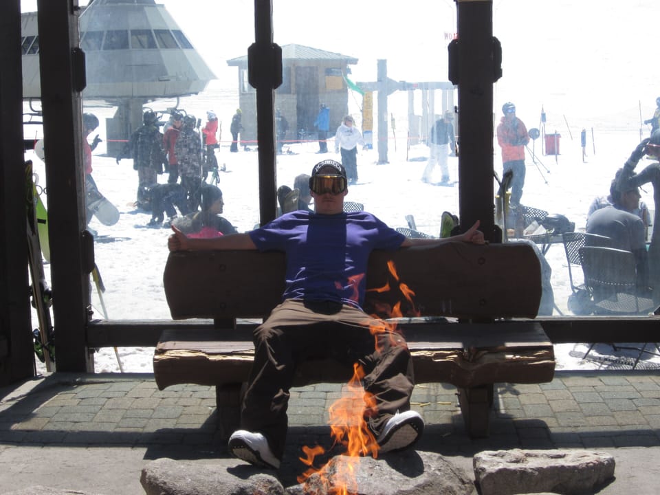 Blaine enjoying the fire at the lodge up the hill.