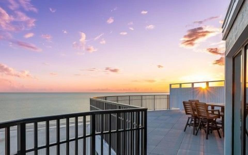 Breathe in the salty air from your spacious balcony as the sun sets over the Gulf waters