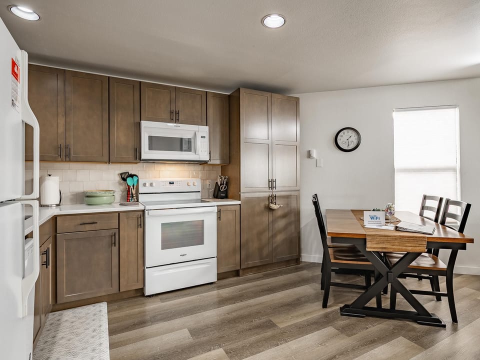Bright, modern kitchen and dining area with cozy charm