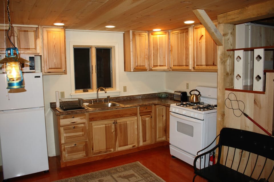Kitchen complete with dishes, silverware and all cooking equipment