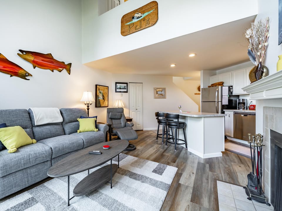 comfy living area with wood burning fireplace