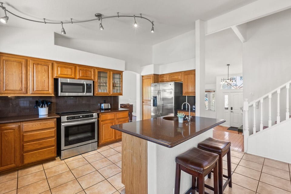 Spacious kitchen with stainless steel appliances—perfect for home cooking.
